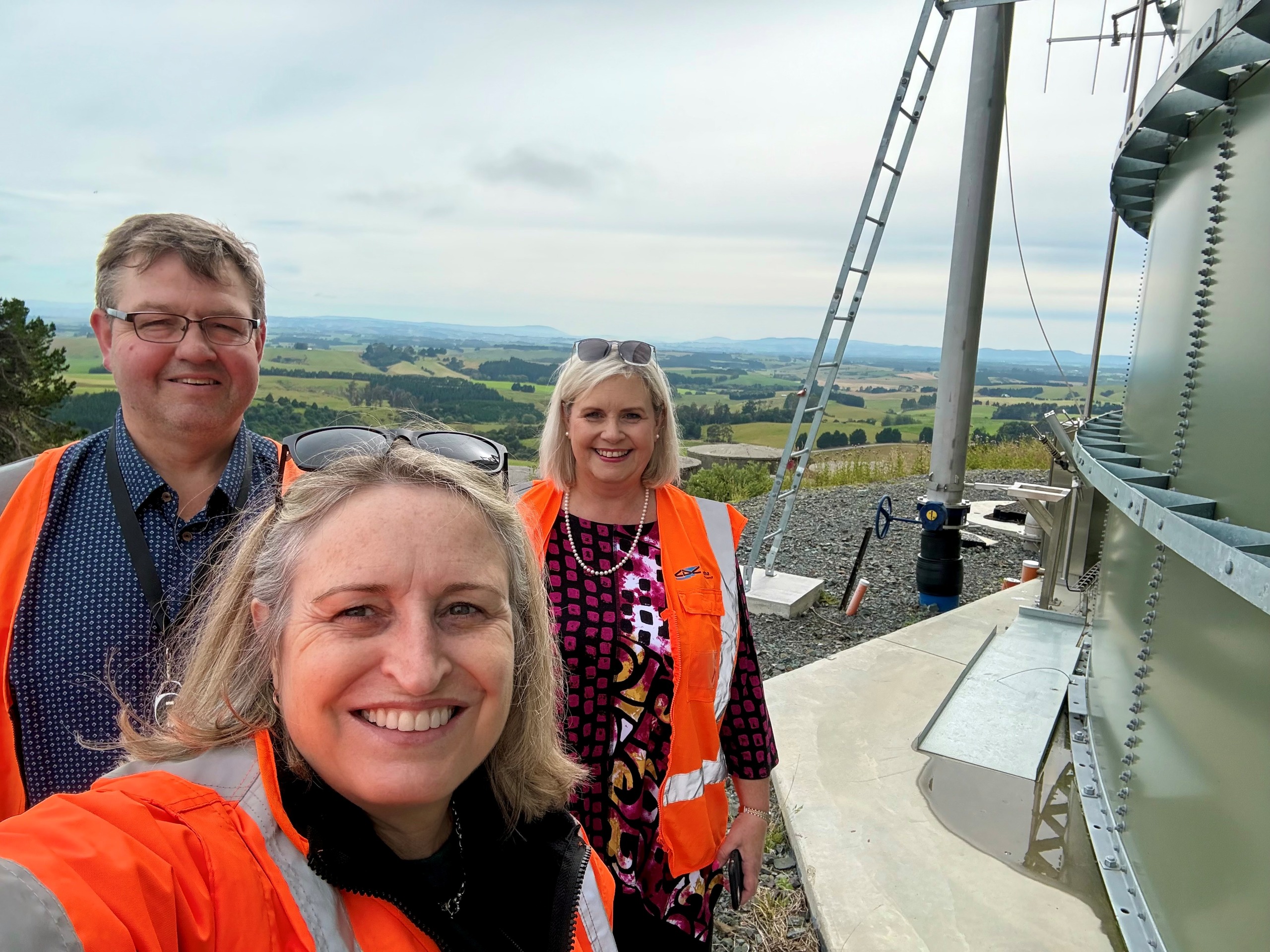 ​Southern Waters Programme Director Fiona Smith (middle) at the Richardson South Treated Water Reservoir with Clutha District Deputy Chief Executive Jules Witt and Three Waters Group Manager Linda Till. 